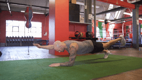 Alternating Superman Plank and Reach exercise